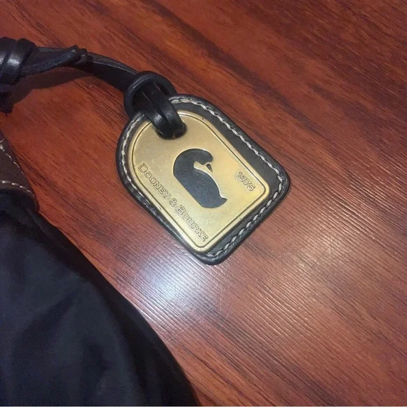 Dooney & Bourke Black Crossbody Bag with Gold Accents - Picture 4 of 10